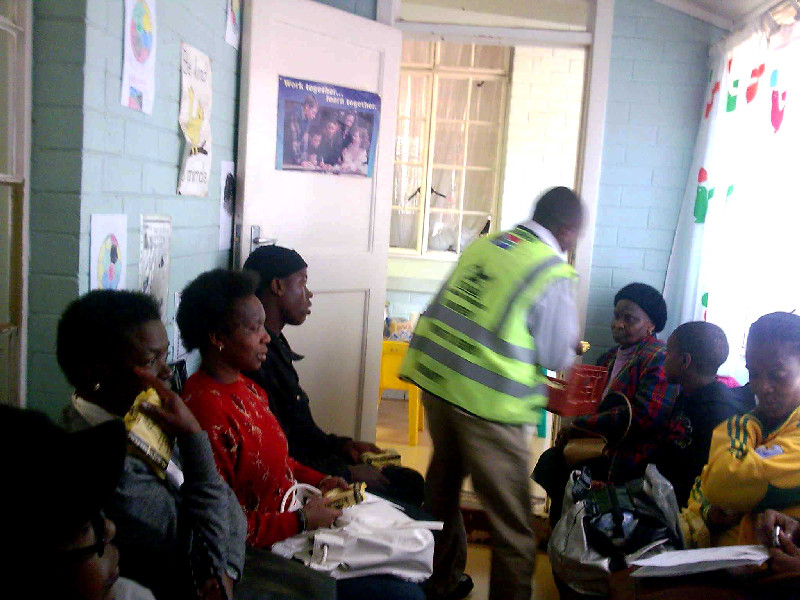 Patients wait eagerly for the much needed sandwiches preapred by AIF volunteers.