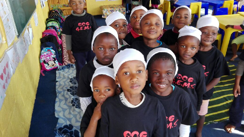 Young students at the Sinothando Crèche gather around during a visit by the Al-Imdaad Foundation’s monitoring team